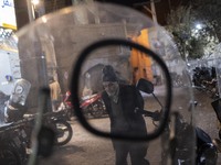 An Iranian elderly man walks along an alley in the holy city of Qom 145 Km (90 miles) south of Tehran at night on March 10, 2022. (