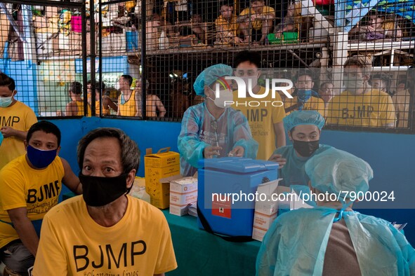 Filipino inmates get their shots of AstraZeneca’s COVID19 vaccine inside the Quezon City Jail in Metro Manila, Philippines on 12 March 2022....