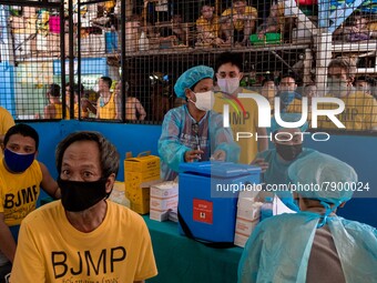 Filipino inmates get their shots of AstraZeneca’s COVID19 vaccine inside the Quezon City Jail in Metro Manila, Philippines on 12 March 2022....