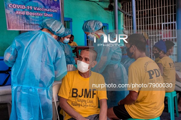 Filipino inmates get their shots of AstraZeneca’s COVID19 vaccine inside the Quezon City Jail in Metro Manila, Philippines on 12 March 2022....