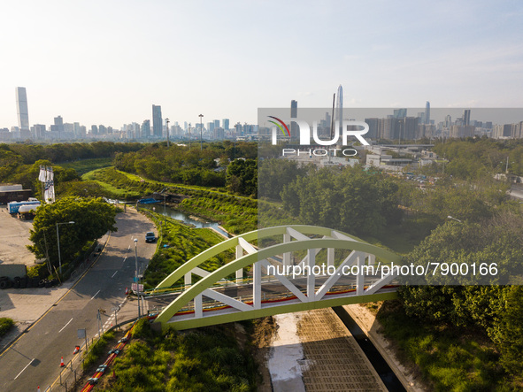  A drone view of a small bridge above a waterway in the town of San Tin, in Northern Hong Kong with the Shenzhen border and the city of Shen...