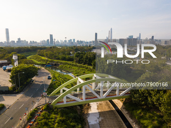  A drone view of a small bridge above a waterway in the town of San Tin, in Northern Hong Kong with the Shenzhen border and the city of Shen...