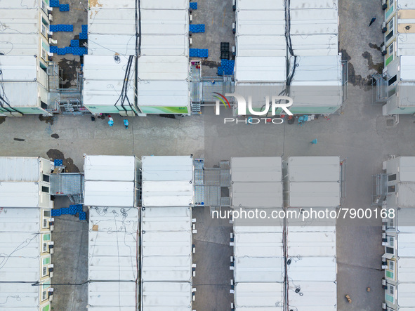  A drone view of the Tsing YI Community Isolation Facility, with staff in blue PPE sitting between the isolation blocks, in Hong Kong, China...