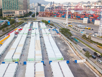  A drone view of the Tsing YI Community Isolation Facility. Covid patients wander in the alleys, out of their residence, in Hong Kong, China...