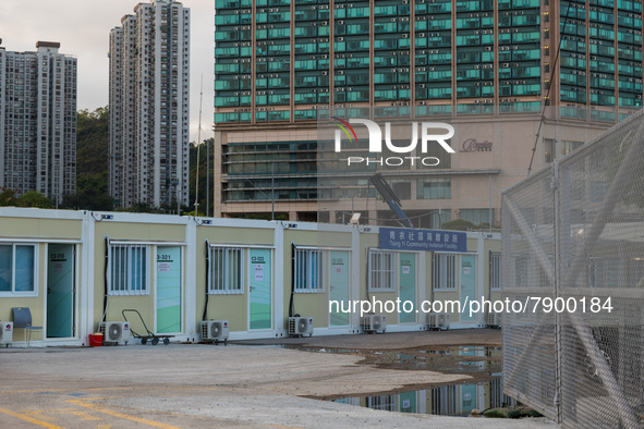  Prefabricated cabins can be seen at the Tsing Yi Community Isolation Facility in front of the Rambler hotel in the background, in Hong Kong...