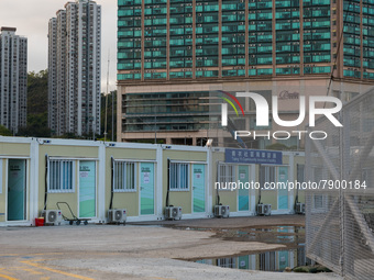  Prefabricated cabins can be seen at the Tsing Yi Community Isolation Facility in front of the Rambler hotel in the background, in Hong Kong...