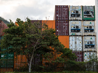  Containers are piled up in a warehouse in Tsing Yi. On the right, refrigerated containers ("reefers") can be seen, in Hong Kong, China, on...