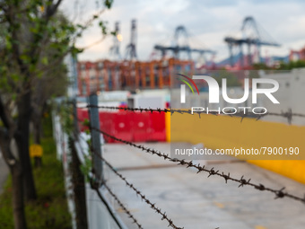  Barbed wires are seen on the barriers of the Tsing Yi Community Isolation Facility for Covid patients, in Hong Kong, China, on Mar 12, 2022...