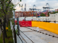  Barbed wires are seen on the barriers of the Tsing Yi Community Isolation Facility for Covid patients, in Hong Kong, China, on Mar 12, 2022...