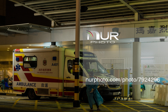 A paramedic in PPE waits for an ambulance near a makeshift triage area at Princess Margaret hospital, in Hong Kong, China, on March 16, 2022...