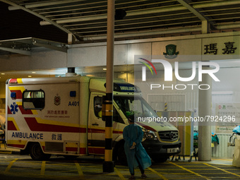 A paramedic in PPE waits for an ambulance near a makeshift triage area at Princess Margaret hospital, in Hong Kong, China, on March 16, 2022...