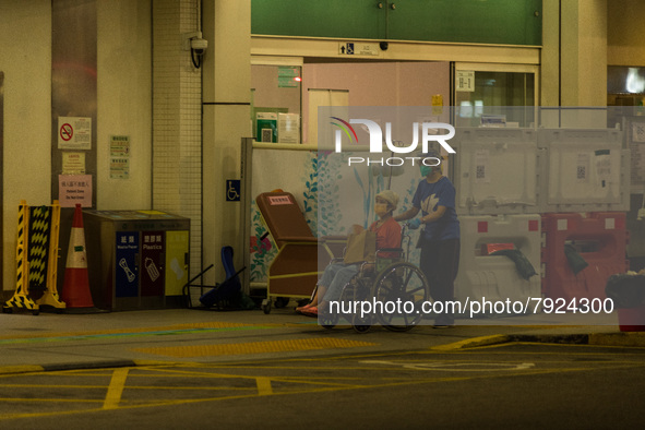 A non-COVID patient is moved away from the Accident & Emergency triage area of Princess Margaret Hospital, in Hong Kong, China, on March 16,...