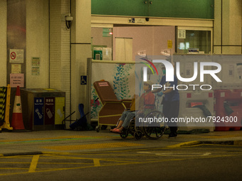 A non-COVID patient is moved away from the Accident & Emergency triage area of Princess Margaret Hospital, in Hong Kong, China, on March 16,...