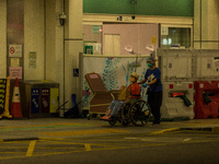 A non-COVID patient is moved away from the Accident & Emergency triage area of Princess Margaret Hospital, in Hong Kong, China, on March 16,...