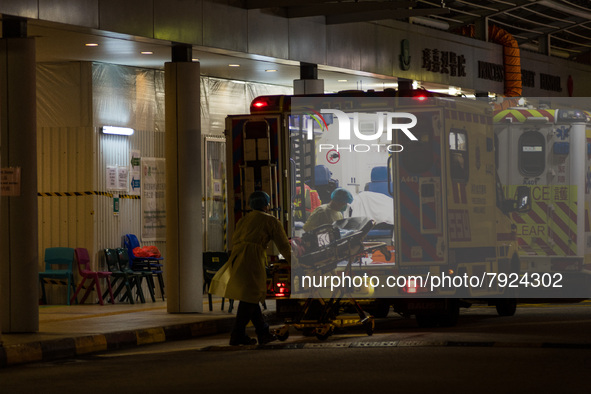 Paramedics load back their stretcher in the ambulance after having brought a patient at the Accident & Emergency ward of Princess Margaret h...