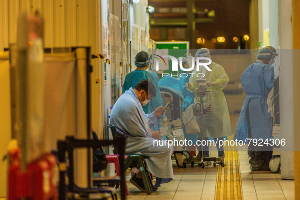 Nurses assist patients in an outdoor triage area at the Accident & Emergency ward of Princess Margaret hospital , in Hong Kong, China, on Ma...