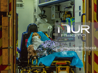 An elderly patient await in an ambulance to be carried to the Accident & Emergency ward of Princess Margaret ward, in Hong Kong, China, on M...