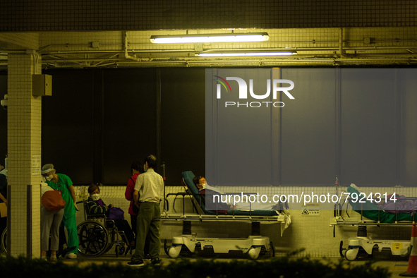 Non-COVID patients wait outdoors for a bed to be available in Princess Margaret hospital, in Hong Kong, China, on March 16, 2022, in Hong Ko...