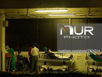 Non-COVID patients wait outdoors for a bed to be available in Princess Margaret hospital, in Hong Kong, China, on March 16, 2022, in Hong Ko...