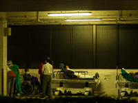 Non-COVID patients wait outdoors for a bed to be available in Princess Margaret hospital, in Hong Kong, China, on March 16, 2022, in Hong Ko...