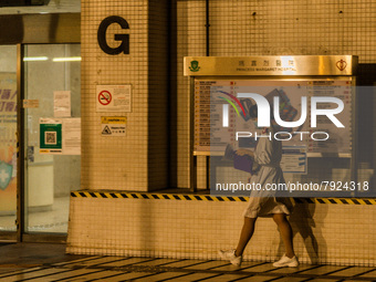 A nurse walks outside Princess Margaret hospital, in Hong Kong, China, on March 16, 2022, in Hong Kong, China, on March 16, 2022.   (