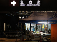 Patients wait for treatment at the Accident & Emergency ward of Caritas Medical Centre, in Hong Kong, China, on March 16, 2022, in Hong Kong...