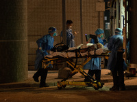 An elderly patient is brought to the Caritas Medical Centre with an automated chest compression device attached, in Hong Kong, China, on Mar...