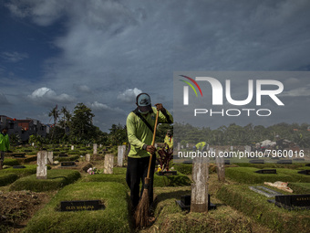 Officers clean the COVID-19 graveyard in Srengsesngsawah, South Jakata, Jakarta, Indonesia. Towards Ramadan, officers clean the graves, so t...