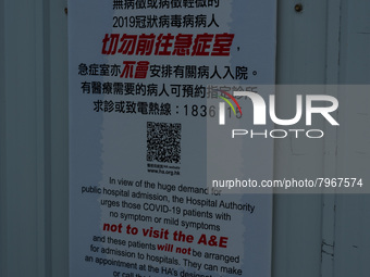 A poster warns asymptomatic or mild symptoms COVID patients not to come to the hospital at United Christian Hospital, in Hong Kong, China, o...