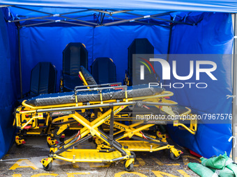 Empty and disinfected stretchers are stored under a tent near the Accident & Emergency ward of United Christian Hospital in Kwun Tong, in Ho...