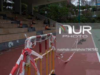 Makeshift barriers cordon off a football pitch in Kwun Tong, in Hong Kong, China, on March 24, 2022.  (