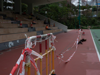 Makeshift barriers cordon off a football pitch in Kwun Tong, in Hong Kong, China, on March 24, 2022.  (