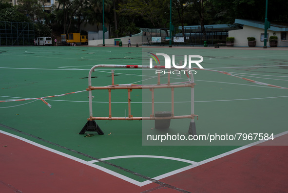 Makeshift barriers cordon off a football pitch in Kwun Tong, in Hong Kong, China, on March 24, 2022.  