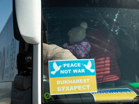 Ukrainian citizens are seen getting the bus headed to Bucarest, Romania, at the transit point for refugees in Palanca, south Moldova, on 202...