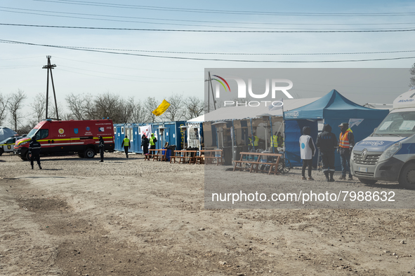 Humanitarian team members are seen at the transit point for refugees in Palanca, south Moldova, on 2022-03-27. 