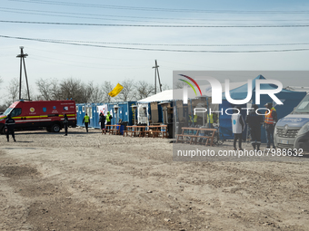 Humanitarian team members are seen at the transit point for refugees in Palanca, south Moldova, on 2022-03-27. (