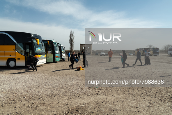 Ukrainian citizens are seen getting the buses at the transit point for refugees in Palanca, south Moldova, on 2022-03-27. 