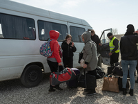 Ukrainian citizens just arrived from the border are seen at the transit point for refugees in Palanca, south Moldova, on 2022-03-27. (