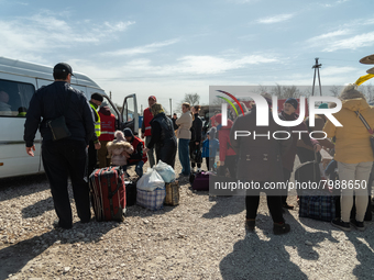 Ukrainian citizens just arrived from the border are seen at the transit point for refugees in Palanca, south Moldova, on 2022-03-27. (