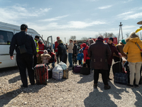 Ukrainian citizens just arrived from the border are seen at the transit point for refugees in Palanca, south Moldova, on 2022-03-27. (