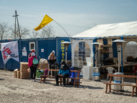 Ukrainian citizens are seen resting at the transit point for refugees in Palanca, south Moldova, on 2022-03-27. (