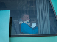 Ukrainian citizens are seen through the screen of a bus headed to Bucarest, Romania, at the transit point for refugees in Palanca, south Mol...