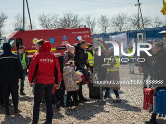 Ukrainian citizens just arrived from the border are seen at the transit point for refugees in Palanca, south Moldova, on 2022-03-27. (