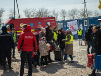 Ukrainian citizens just arrived from the border are seen at the transit point for refugees in Palanca, south Moldova, on 2022-03-27. (