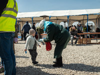 An Ukrainian grandmother and her grandson just arrived from the border are seen at the transit point for refugees in Palanca, south Moldova,...