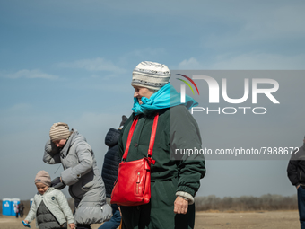 Ukrainian citizens are seen at the transit point for refugees in Palanca, south Moldova, on 2022-03-27. (