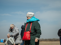 Ukrainian citizens are seen at the transit point for refugees in Palanca, south Moldova, on 2022-03-27. (