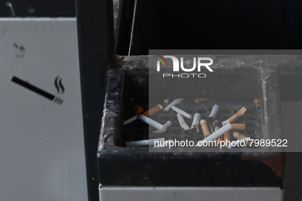 Cigarette butts are seen in a trash can in Krakow, Poland on March 28, 2022. 