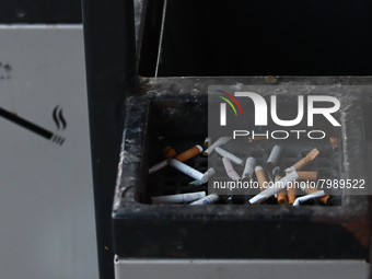 Cigarette butts are seen in a trash can in Krakow, Poland on March 28, 2022. (