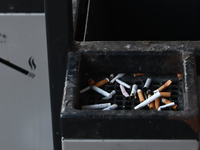 Cigarette butts are seen in a trash can in Krakow, Poland on March 28, 2022. (